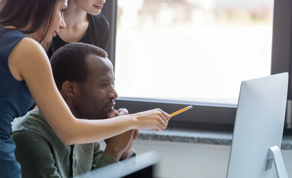 Man learning to code with Zaio Bootcamps